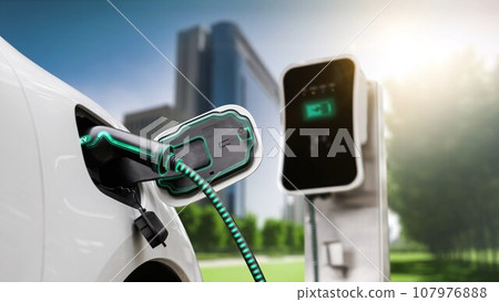 Electric car plugged in with charging station to recharge battery. Peruse Electric car plugged in with charging station to recharge battery. Peruse 107976888