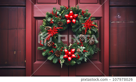 christmas wreath hanging on front door christmas wreath hanging on front door 107978026