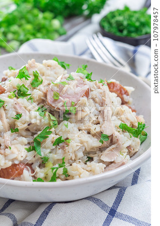 South Carolina chicken bog dish with smocked sausages, in bowl, vertical South Carolina chicken bog dish with smocked sausages, in bowl, vertical 107978457