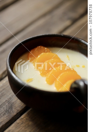 Yogurt jelly decorated with mandarin oranges served on Japanese tableware 107978738