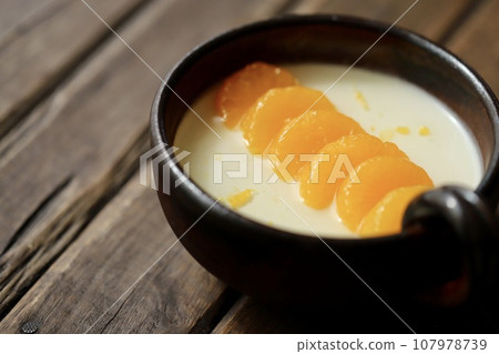 Yogurt jelly decorated with mandarin oranges served on Japanese tableware 107978739