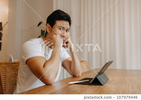 Serious and crying face of man working in the cafe. 107979446