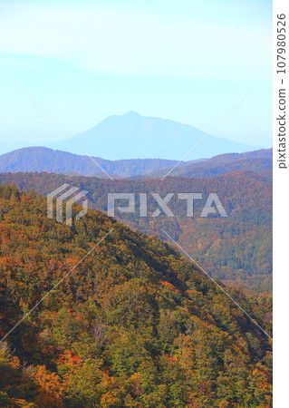 Autumn-colored mountains and Mt. Iwaki seen from around Jogakura Ohashi Bridge Autumn-colored mountains and Mt. Iwaki seen from around Jogakura Ohashi Bridge 107980526