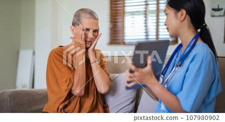 doctor video call discussion results or symptoms and gives a recommendation to a senior male patient, having constipation during medical examination in clinic 107980902