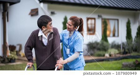 Nurse or caregiver hand on walking frame for support, help or trust moving leg in rehabilitation. Physiotherapy healthcare, Medical caregiver consulting disabled elderly patient at home 107980949