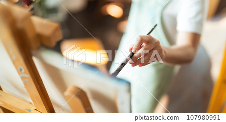 hand of artist with brush painting picture art, creativity, artistic and artwork, painting concept 107980991