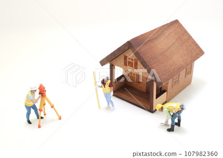 the figure of Surveyor at the construction site 107982360