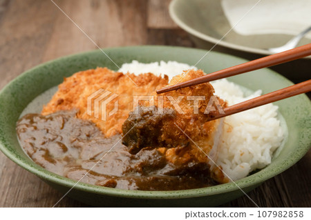 Cutlet curry with chopsticks 107982858