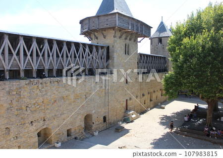 The courtyard of the Cité fortress in Carcassonne, France The courtyard of the Cité fortress in Carcassonne, France 107983815