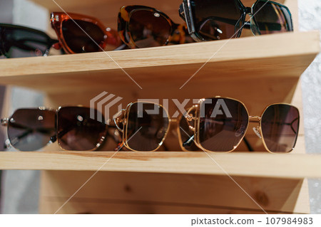 Fashion glasses store. Image and style services, selection of colors, types. Fashion glasses store. Image and style services, selection of colors, types. 107984983