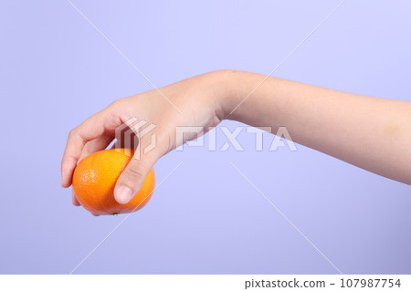 Hand with Fruit 107987754
