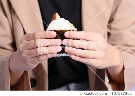 Hand Holding Food 107987803