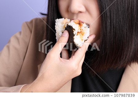 Hand Holding Food 107987839