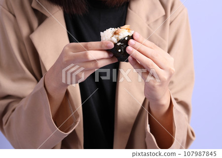 Hand Holding Food 107987845