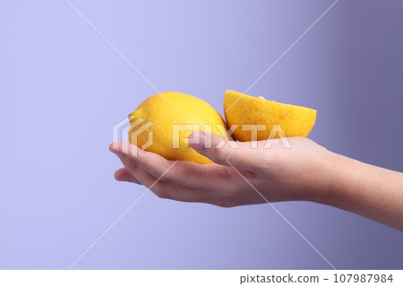Hand with Fruit 107987984