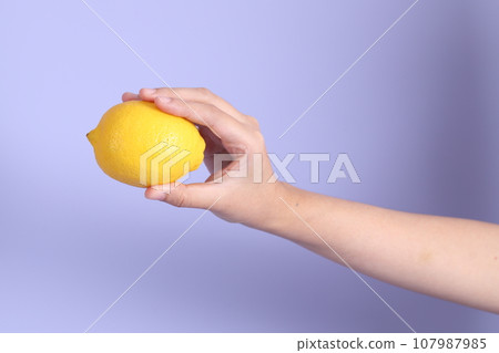 Hand with Fruit 107987985