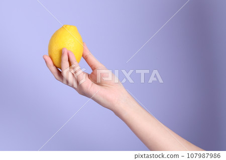 Hand with Fruit 107987986