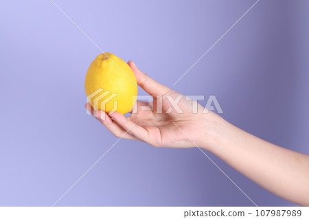 Hand with Fruit 107987989