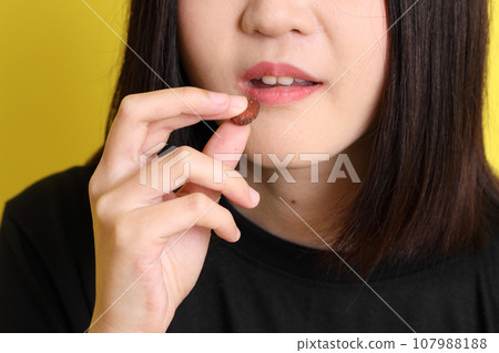 Hand with Snack Hand with Snack 107988188