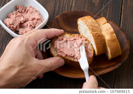 Spread beef liver on the baguette Spread beef liver on the baguette 107989815