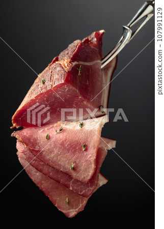 Dry-cured pork fillet with thyme. 107991129