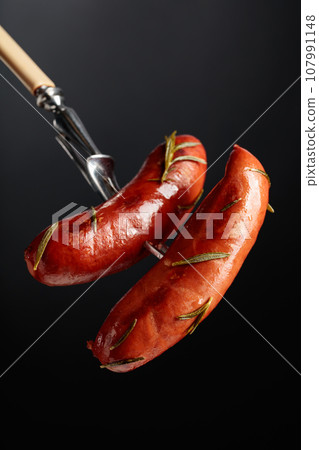 Roasted Bavarian sausages with rosemary. Roasted Bavarian sausages with rosemary. 107991148