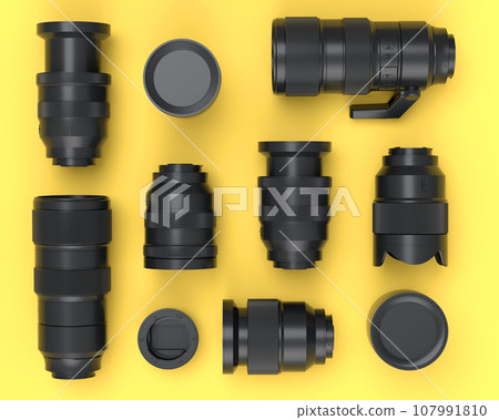 Top view of monochrome designer workspace and photography gear on yellow Top view of monochrome designer workspace and photography gear on yellow 107991810