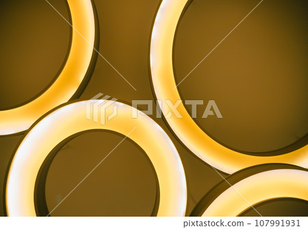 The interior modern round lamp fixtures when looking up to the ceiling illuminate warm light room. The interior modern round lamp fixtures when looking up to the ceiling illuminate warm light room. 107991931