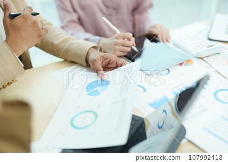 Asian entrepreneurs and business people meeting in a conference room in business planning, financial budget and investment risk assessment to analyze customer groups to increase company growth. 107992418