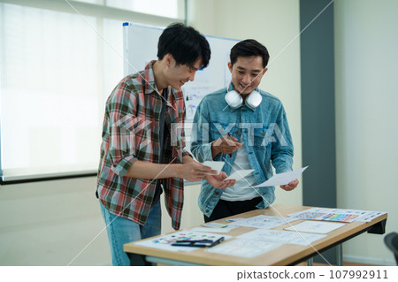 Group of asian creative team programing designers participate in all phases of the UX UI design Group of asian creative team programing designers participate in all phases of the UX UI design 107992911