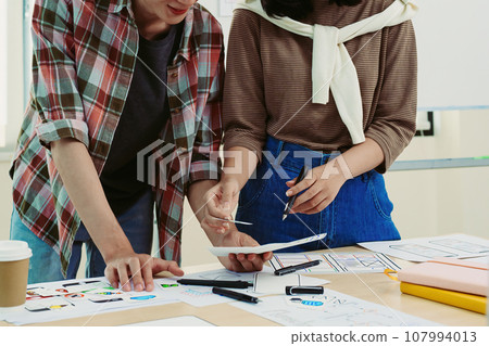 Group of asian creative team programing designers participate in all phases of the UX UI design Group of asian creative team programing designers participate in all phases of the UX UI design 107994013