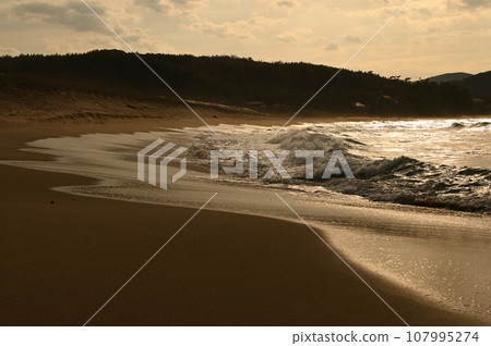 big waves hitting the coast 107995274