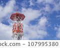 Red steel tower shining against the blue sky 107995380