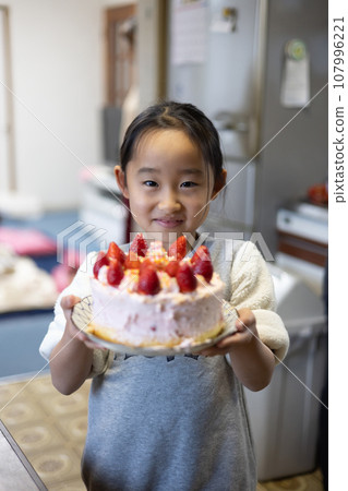 girl making cake at home girl making cake at home 107996221