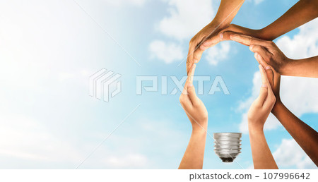Symbols and shapes of light bulbs created by hand. People thinking together and team ideas coming together joining hands. Symbols and shapes of light bulbs created by hand. People thinking together and team ideas coming together joining hands. 107996642