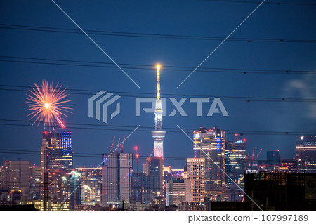 Kawasaki cityscape in Japan Tamagawa Fireworks Festival for the first time in 4 years. The venue side of the Kawasaki City Memorial Tamagawa Fireworks Festival. Roppongi Hills etc. in the back 107997189