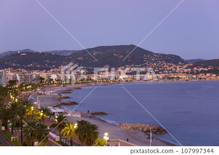 Mediterranean sea view at night in Nice, France 107997344