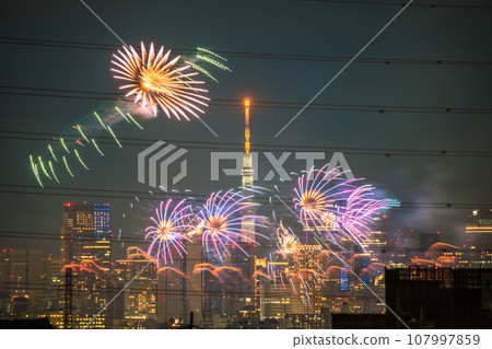 Tokyo cityscape in Japan Tamagawa Fireworks Festival for the first time in 4 years. The venue side of the Kawasaki City Memorial Tamagawa Fireworks Festival. Roppongi Hills etc. in the back Tokyo cityscape in Japan Tamagawa Fireworks Festival for the first time in 4 years. The venue side of the Kawasaki City Memorial Tamagawa Fireworks Festival. Roppongi Hills etc. in the back 107997859