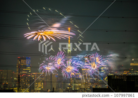 Tokyo cityscape in Japan Tamagawa Fireworks Festival for the first time in 4 years. The venue side of the Kawasaki City Memorial Tamagawa Fireworks Festival. Roppongi Hills etc. in the back Tokyo cityscape in Japan Tamagawa Fireworks Festival for the first time in 4 years. The venue side of the Kawasaki City Memorial Tamagawa Fireworks Festival. Roppongi Hills etc. in the back 107997861