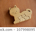 Wooden cat parent and child puzzle made with woodworking 107998095