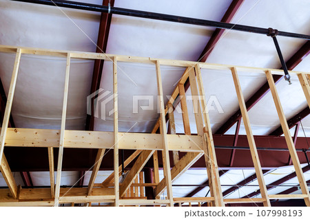 Construction roof structure of steel frame timber joists for large modern warehouse hangar 107998193