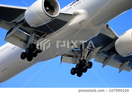 Passenger plane taking off and landing image 107999100