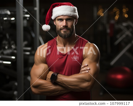 Santa Claus fitness trainer. A muscular man in a gym Santa Claus fitness trainer. A muscular man in a gym 107999117