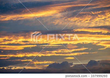 orange sunset clouds orange sunset clouds 107999260