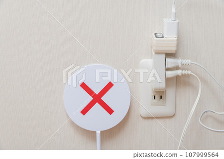 [Octopus-like wiring with many outlets plugged in] 107999564