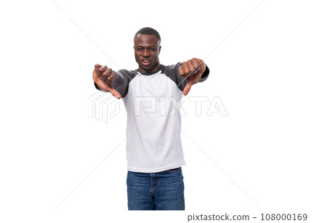 close-up portrait of a young handsome american guy with a short haircut in a sweatshirt pointing 108000169