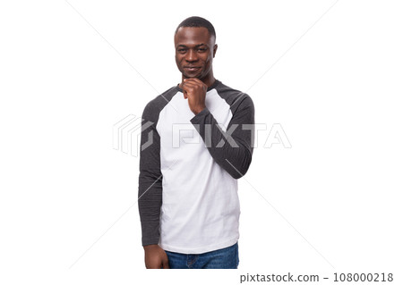 portrait of a young american guy with a short haircut dressed in a long sleeve sweater 108000218