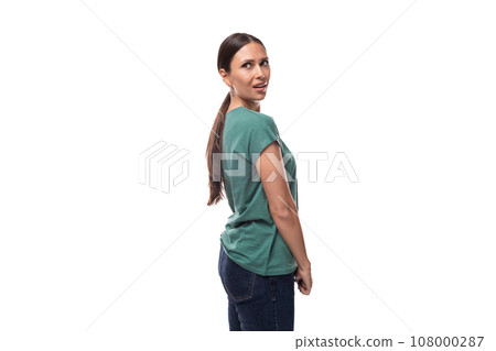 30 year old slender European brunette woman with a ponytail hairstyle dressed in a green T-shirt 108000287