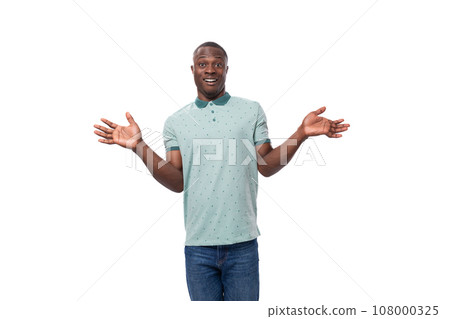 young handsome smiling african man dressed casually having doubts and thinking young handsome smiling african man dressed casually having doubts and thinking 108000325