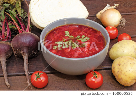 Borscht soup with vegetables and meat on a wooden table 108000525